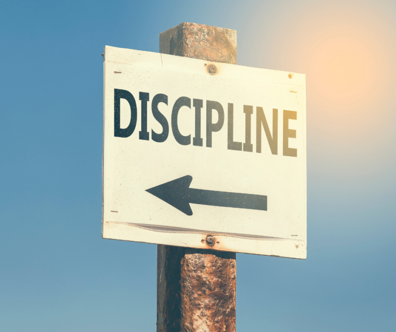 Sign on a post that says Discipline