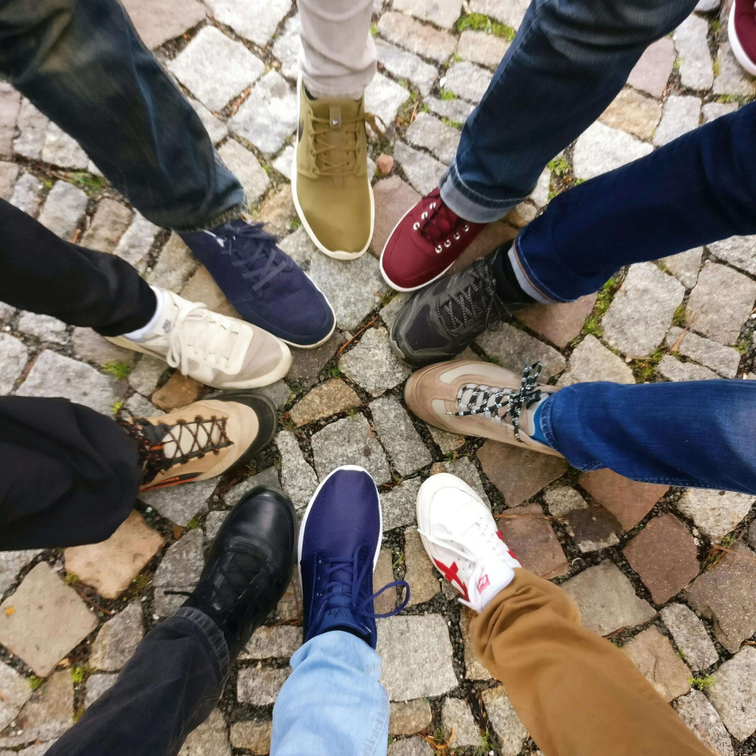 bible verses about community (group of people standing with their shoes in the center)